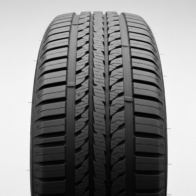 Close-up of an all-season tire with a detailed tread pattern on a clean background