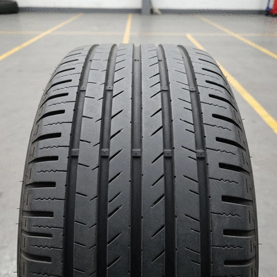 Close-up of a used tire with good tread, emphasizing durability and eco-friendliness